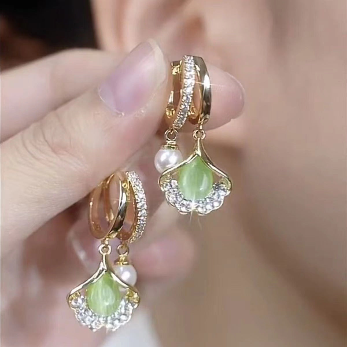 ✨【Cumpărați 1, primiți 1 gratuit】Cat Eye Ginkgo Leaf Stud Cercei